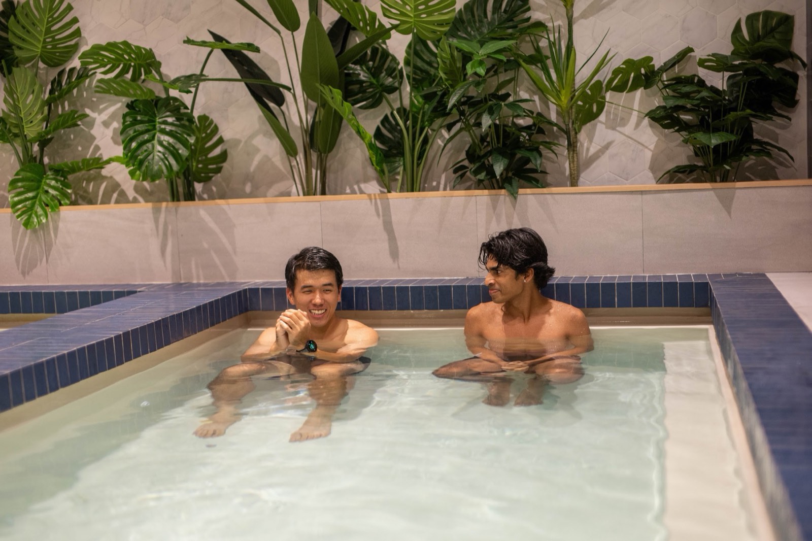 Two friends settling into the ice bath at Duxton, Singapore