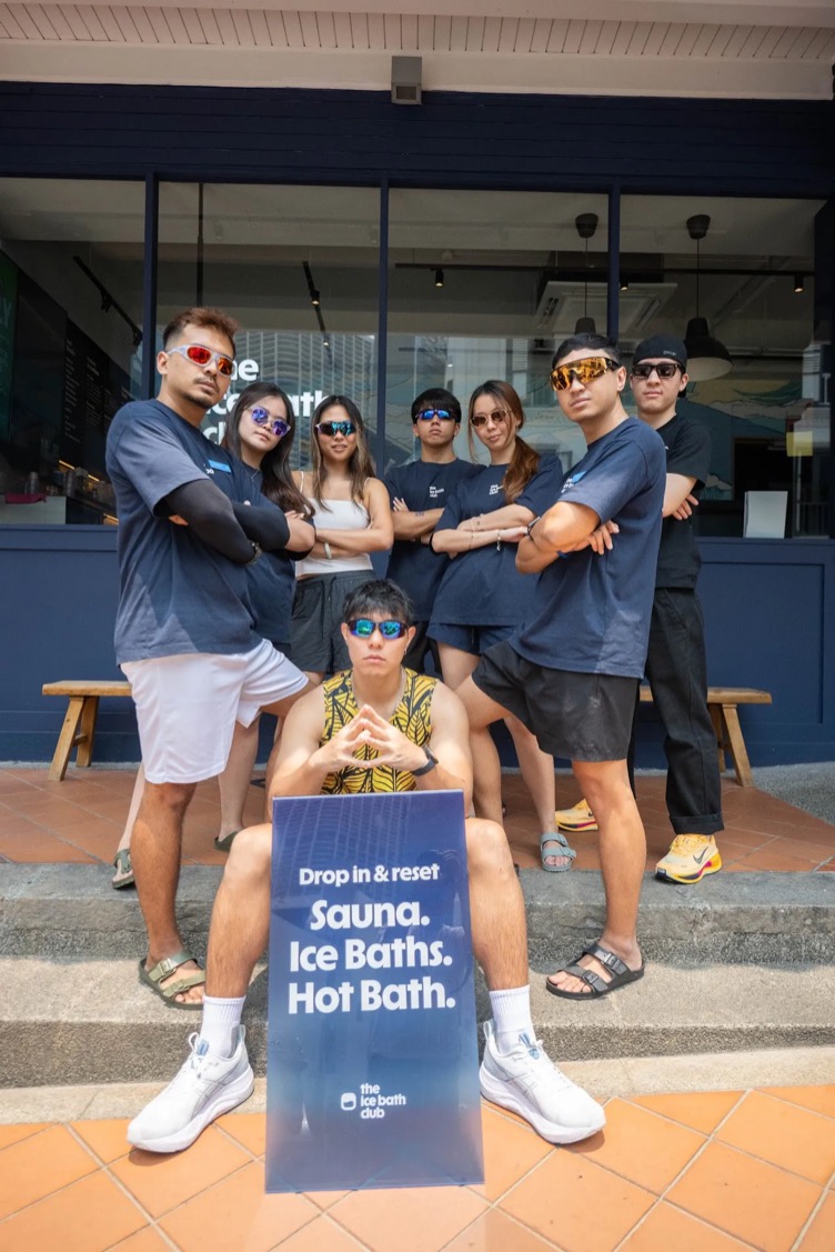 The team in sunglasses on the club steps