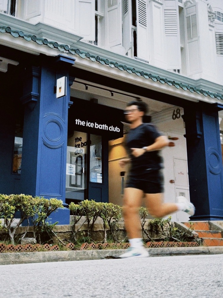 A runner passing the club on the street