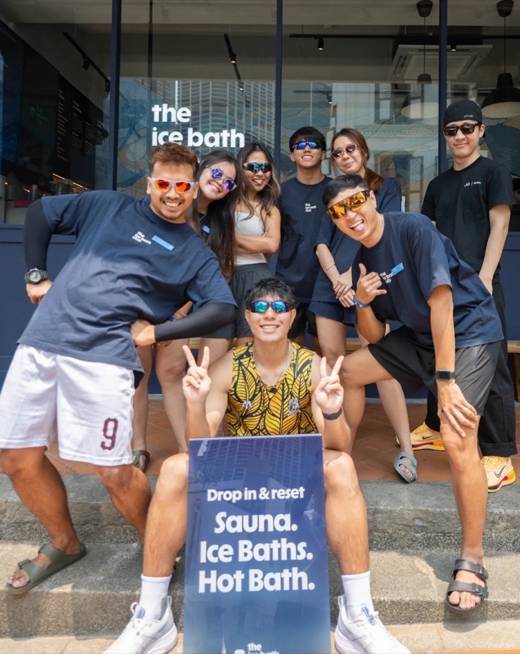 The team in sunglasses on the club steps
